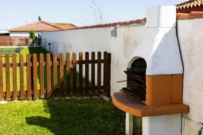 a living room with a couch and a table at Atlantic Sun Villa - Chiclana in Chiclana de la Frontera