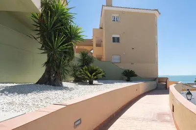 a view from the balcony of a building with palm trees at Apartoyou - Balandro Suite in El Puerto de Santa María