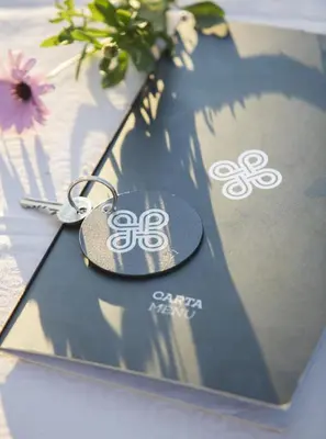a key chain sitting on top of a table at Hotel Tugasa Villa de Algar in Algar