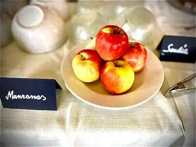 a plate of apples on top of a table at Hotel Tugasa Villa de Algar in Algar