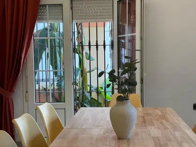 a vase sitting on a table in a dining room at Chalet San Francisco in Sanlúcar de Barrameda