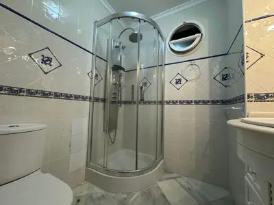 a bathroom with a shower and a toilet at Chalet San Francisco in Sanlúcar de Barrameda