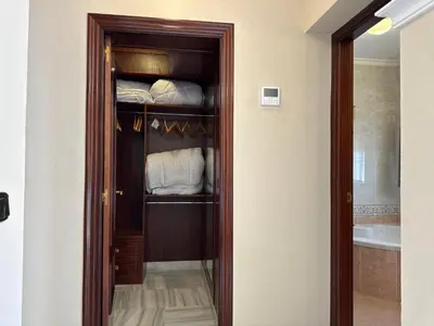 a room with a closet with towels in it at Chalet San Francisco in Sanlúcar de Barrameda