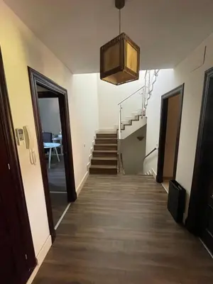 a hallway with a staircase and a stair case at Casa Savile in Novo Sancti Petri