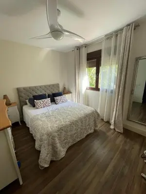 a bedroom with a bed and a ceiling fan at Casa Savile in Novo Sancti Petri