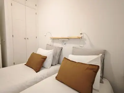 a room with a couch with pillows on it at El Tesoro de Cadiz in Cádiz
