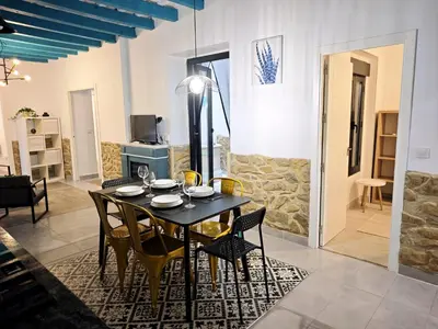a dining room with a table and chairs at El Tesoro de Cadiz in Cádiz