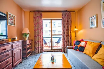 a living room with a couch and a table at Edomus Faro de Rota in Rota