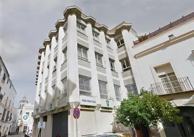 a white building on a city street at Brand new apartment in the heart of Jerez! in Jerez de la Frontera