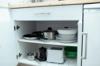 a kitchen pantry with plates and dishes in it at Apartamento SOL Y DUENDE in Jerez de la Frontera