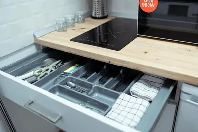 an open drawer in a kitchen with a counter at Apartamento SOL Y DUENDE in Jerez de la Frontera