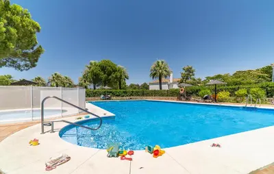 a swimming pool with a slide in the middle at 2 Bedroom Nice Home In Arcos De La Frontera in Arcos de la Frontera