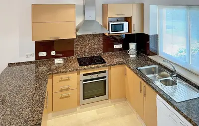 a small kitchen with a sink and a microwave at 2 Bedroom Nice Home In Arcos De La Frontera in Arcos de la Frontera
