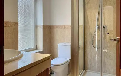 a bathroom with a toilet and a sink and a shower at 2 Bedroom Nice Home In Arcos De La Frontera in Arcos de la Frontera