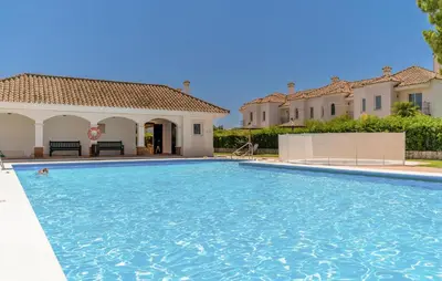 a swimming pool in front of a villa at 2 Bedroom Nice Home In Arcos De La Frontera in Arcos de la Frontera