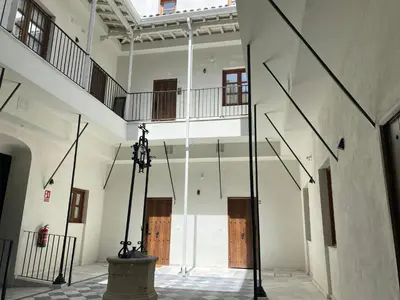 a view of the inside of a building with doors at La Bohéme in Jerez de la Frontera