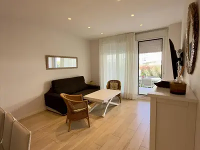 a living room with a couch and a table at Amenábar Ocean Suites by Staycare in Chipiona