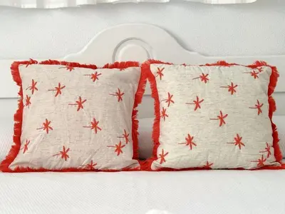 a pair of pillows sitting on a bed at Sibs Sanlucar Bajamar - Bright & Central in Sanlúcar de Barrameda