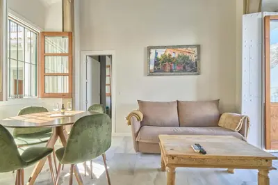 a living room with a couch and a table at Refugio de Visitación in Jerez de la Frontera
