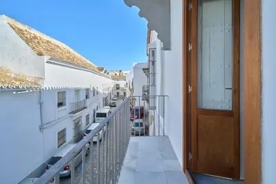 a balcony with a door and a view of a city at Refugio de Visitación in Jerez de la Frontera