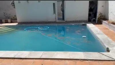 a swimming pool with blue water and a basketball at Mar de Luz Boutique in Novo Sancti Petri