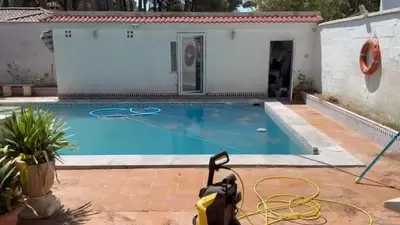 a house with a swimming pool with a vacuum at Mar de Luz Boutique in Novo Sancti Petri