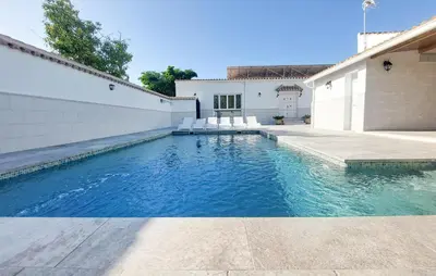 a swimming pool in the backyard of a house at Lovely Home In San Antoniojerez De L With Wifi in La Barca de la Florida