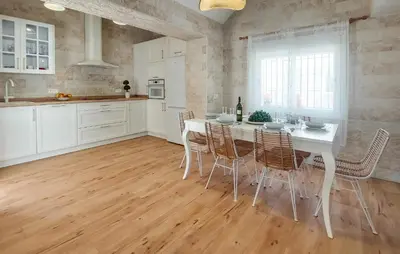 a kitchen with a white table and chairs at Lovely Home In San Antoniojerez De L With Wifi in La Barca de la Florida