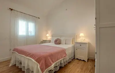 a bedroom with a bed with two night stands and two lamps at Lovely Home In San Antoniojerez De L With Wifi in La Barca de la Florida