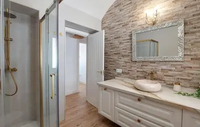 a bathroom with a sink and a mirror on a brick wall at Lovely Home In San Antoniojerez De L With Wifi in La Barca de la Florida