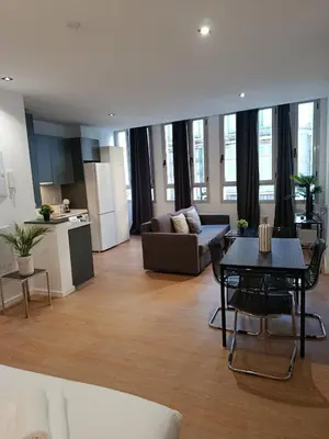 a living room with a couch and a table at Allo Apartments Santa María IV Centro Loft in Jerez de la Frontera