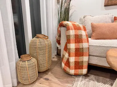 a living room with two ottomans and a couch at Hidden Gem GRAN TEATRO FALLA SUITES by ApartmentsinCadiz in Cádiz