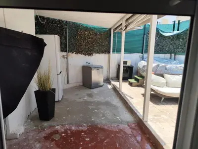 an empty room with a bed and a window at Serenity Boutique Home in Chiclana de la Frontera
