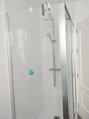 a bathroom with a shower with a glass door at plaza esteve in Jerez de la Frontera