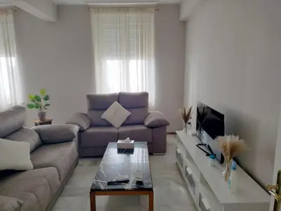 a living room with a couch and a coffee table at plaza esteve in Jerez de la Frontera