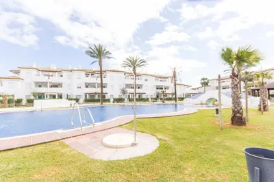 an image of a swimming pool at a resort at Apartamentos Turísticos Taymar in Chiclana de la Frontera