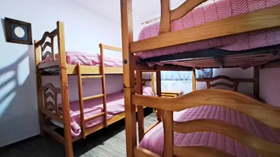 a group of bunk beds in a room at Apartamento en primera linea de playa in Novo Sancti Petri