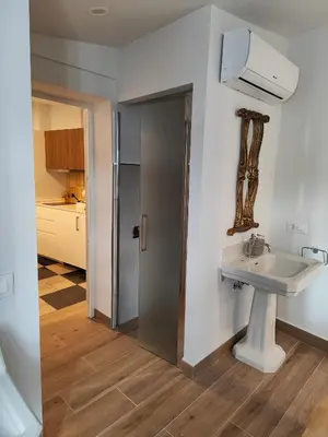 a bathroom with a sink and a mirror at castellano home in Jerez de la Frontera