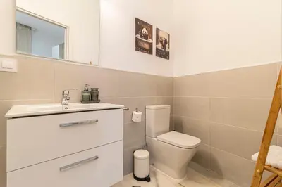 a bathroom with a toilet and a sink at Jerez Boutique by Sanz in Jerez de la Frontera