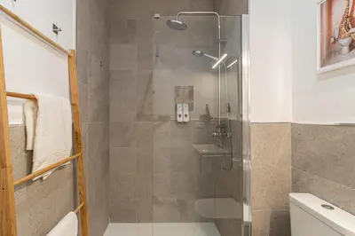 a shower with a glass door in a bathroom at Jerez Boutique by Sanz in Jerez de la Frontera
