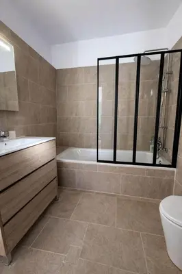 a bathroom with a tub and a toilet and a sink at Finca Feliciano in Novo Sancti Petri