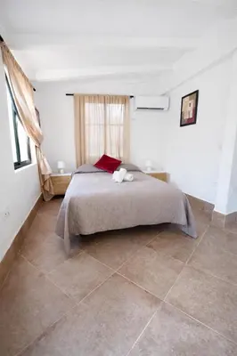 a bedroom with a large bed in a room at Finca Feliciano in Novo Sancti Petri