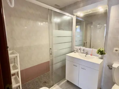 a bathroom with a shower and a sink and a toilet at RESIDENCIAL EL CANO in Rota