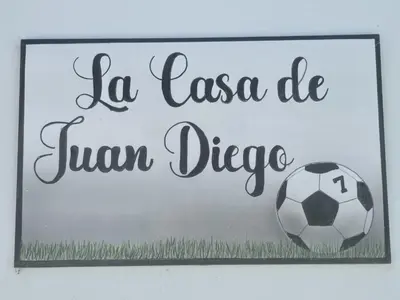 a sign with a soccer ball on a wall at Casas el Palomar in Conil de la Frontera