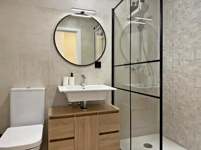 a bathroom with a sink and a mirror at La Solera de Jerez - Ole Solutions in Jerez de la Frontera