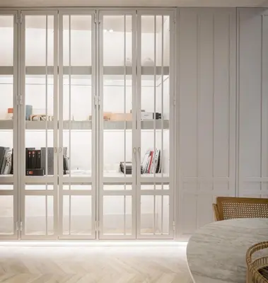 a room with white glass doors with bookshelves at Bombonera in Jerez de la Frontera