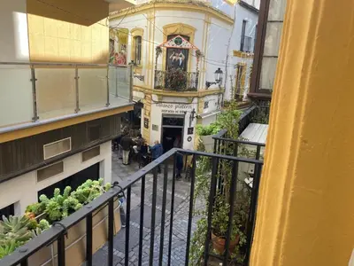 a view from a balcony of a building with a church at Bombonera in Jerez de la Frontera