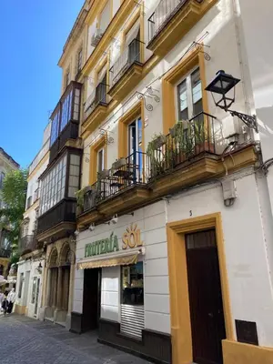 a building with balconies on the side of a street at Bombonera in Jerez de la Frontera
