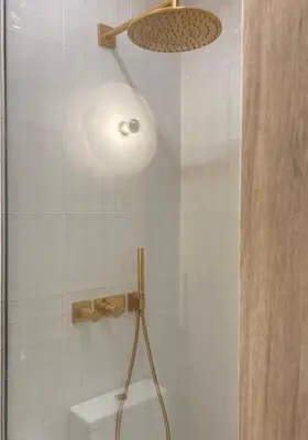a shower with a light in a bathroom at Bombonera in Jerez de la Frontera