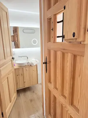 an open door to a bathroom with a sink at Apartamento TATA, Arcos de la Frontera in Arcos de la Frontera